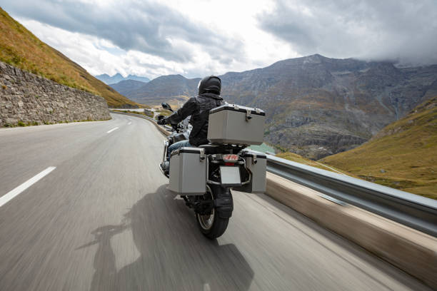 istock Motorbiker riding in Austrian Alps 1455559624