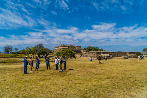 Monte Alban, Mexico – December 04, 2021: The ancient Zapotec structures inside Monte Alban Archaeological Zone in Mexico