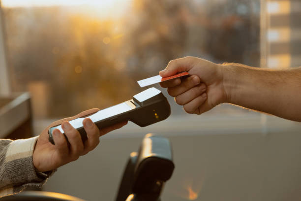 istock Customer paying barber through credit card Contacless payment - Close up shot 1455561406