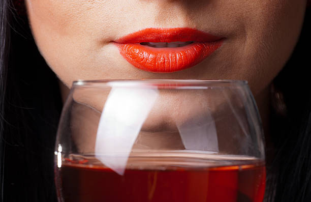 Red lips and glass of wine stock photo