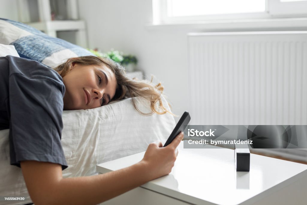 Young woman is waking up Laziness Stock Photo