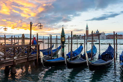 Venice gondolas and San Giorgio Maggiore island at sunset, Italy
