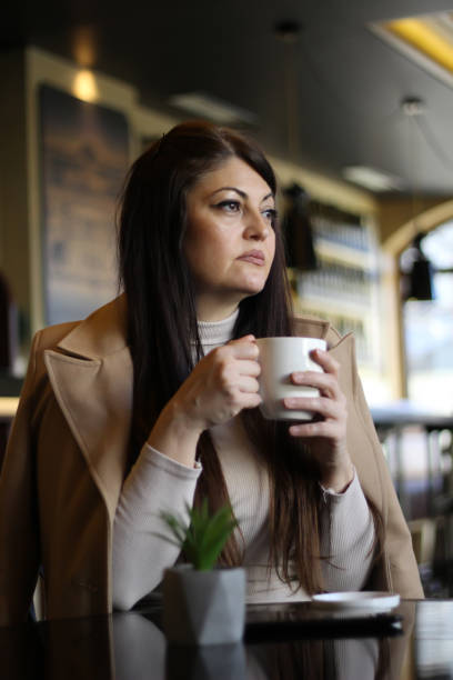 istock A middle-aged woman has a business meeting 1455565455