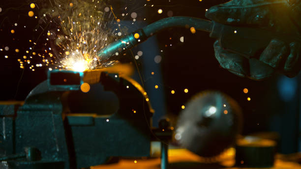 istock Freeze Motion of Working Welder in Workshop. 1455566043