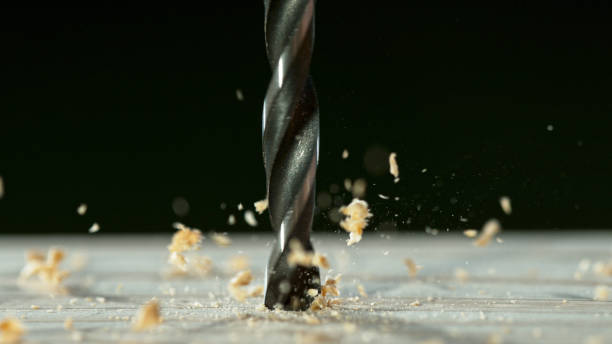 istock Super slow motion of a drill bit drilling into wood 1455566239