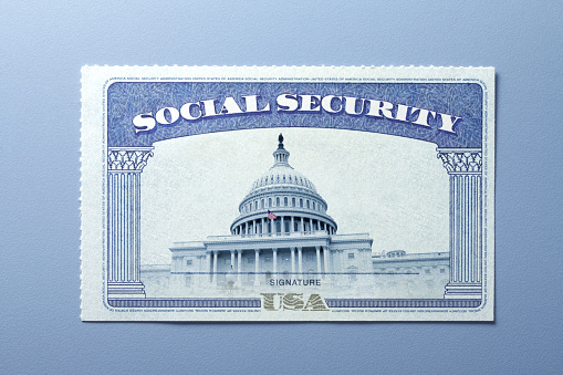 A Social Security card with the United States Capitol building on it.