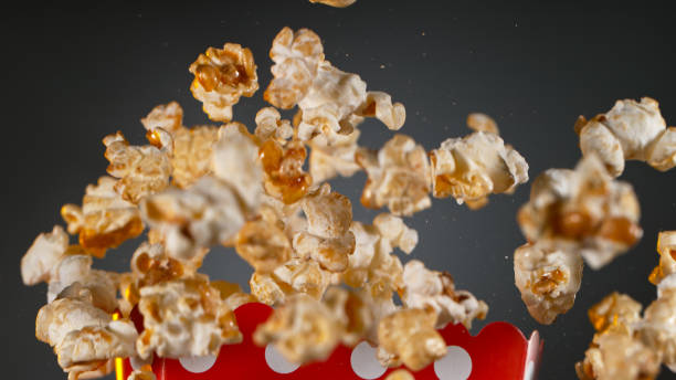 istock Freeze Motion of Popcorn Flying on Gradient Grey Background. 1455568017