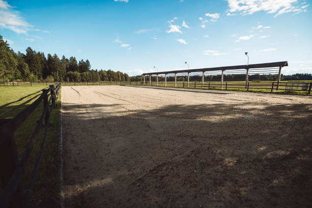 istock Fenced riding ring, for horse back riding on a sunny day at the ranch 1455569775
