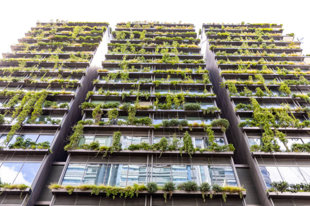 istock Low angle view of apartment building with vertical gardens, background with copy space 1455572123