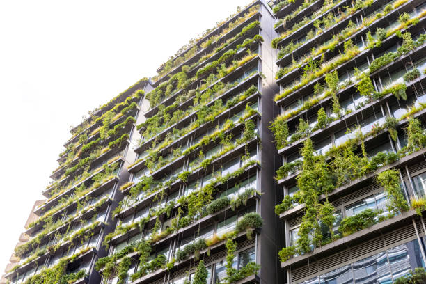 istock Low angle view of apartment building with vertical gardens, background with copy space 1455574252