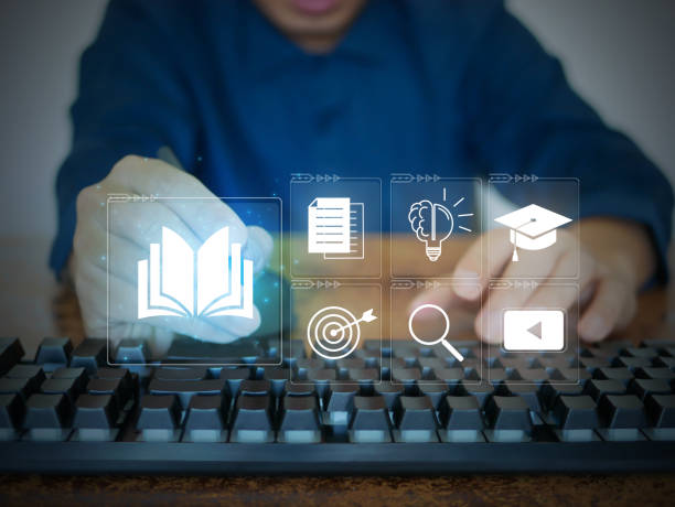 istock E-learning courses. A man attends an online lesson on a virtual digital screen. Internet lessons and online webinars. Technology for education concept 1455575915