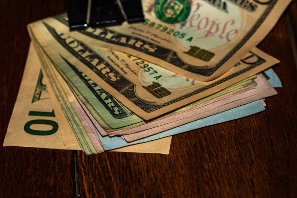 istock Money on the table, dollars on table. Business concept 1455580308