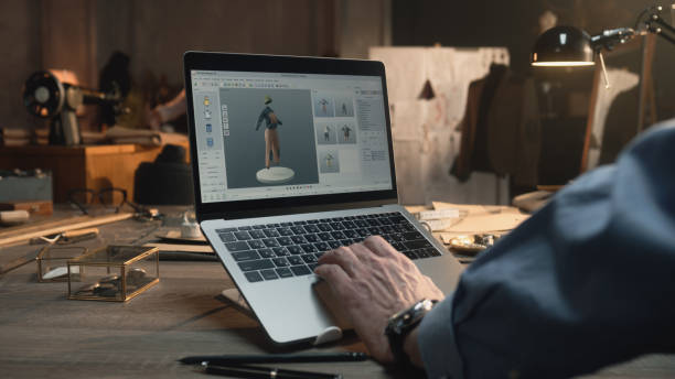 istock Fashion designer works in 3d program on laptop 1455581563