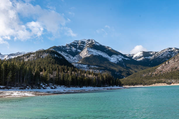 istock Barrier Lake in Bow Valley Provincial Park under a blue cloudy sky on a cold winter day 1455582965