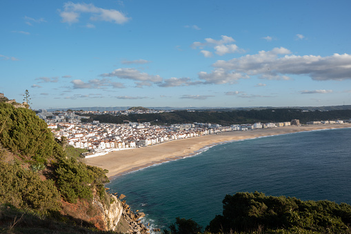 The Atlantic coast with splashing waves near Nazare, Portugal