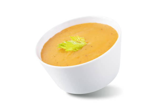 istock Celery carrot puree soup in a bowl on a white isolated background 1455585546