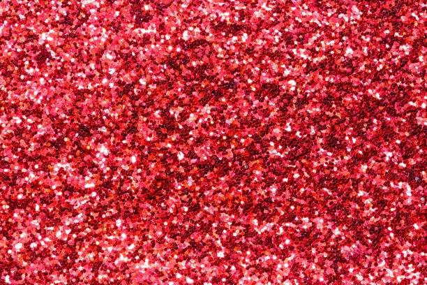 istock RED wide shimmer background with reflective glitter material 1455585766