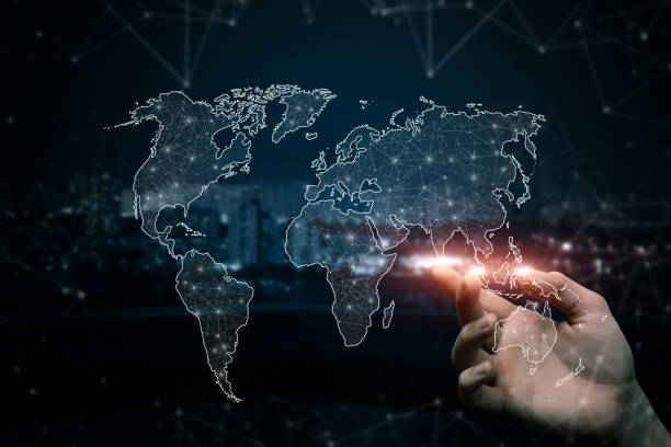 istock Hand clicks on a world map in a network of connections . 1455585815