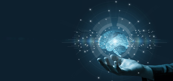 The hand shows the brain of artificial intelligence on a blue background.