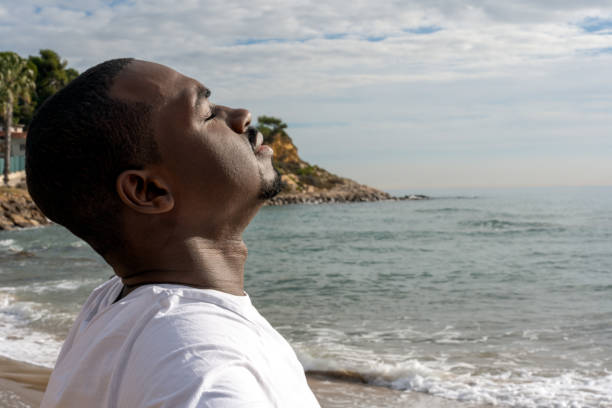 istock Relaxed man enjoying summer vacation on beach 1455586260