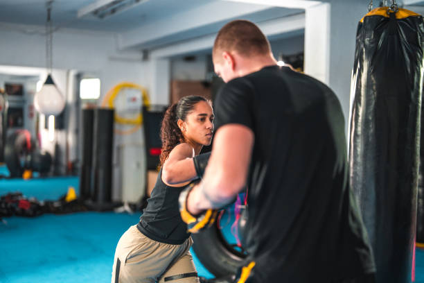 istock Latin Female Boxer Practicing In A Gym 1455587006