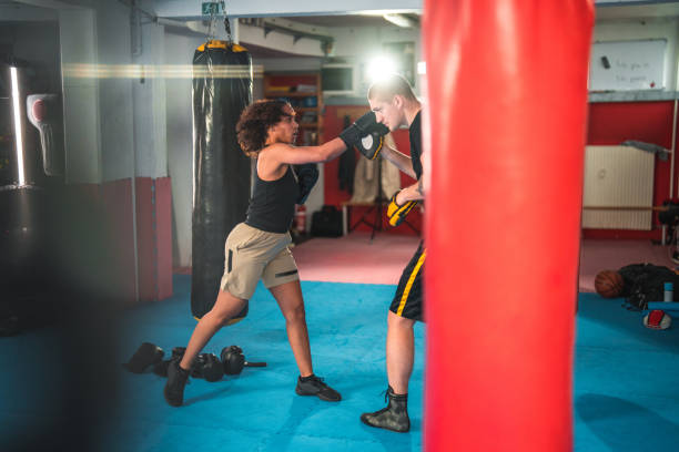 istock Hispanic Female Boxer Practicing In A Gym 1455587117