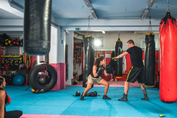 istock Latin Female Boxer Practicing In A Gym 1455587152