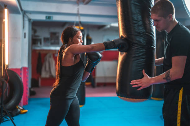 istock Athletic Young Multi-Ethnic Woman Training In A Boxing Class 1455587571