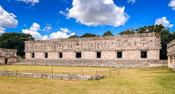 Serpents in the nuns' quadrangle In this building of the quadrangle of the nuns you can see two-headed snakes decorating the facade uxmal stock pictures, royalty-free photos & images