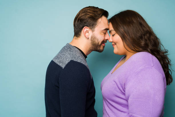 istock Romantic beautiful couple smiling before a kiss 1455588329