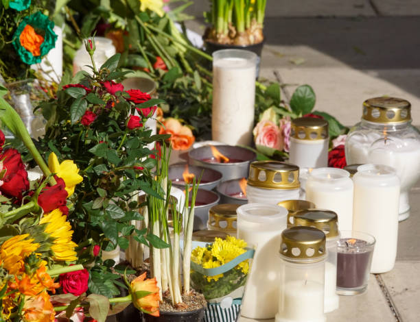 istock flowers and candles on street after terror 1455589904