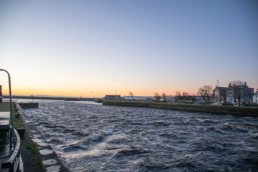 sunrise on the river corrib galway rough water golden hour