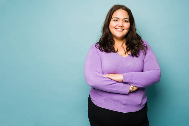 istock Fat latin young woman looking happy 1455591388