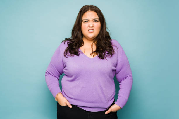 istock Ill fat young woman suffering from nausea 1455591490