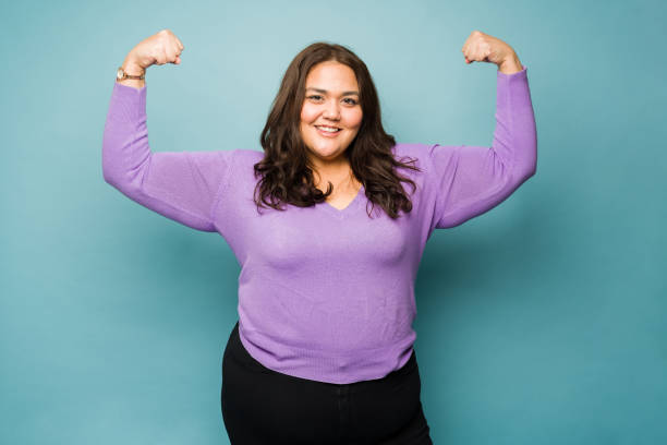 istock Powerful obese woman promoting body positivity 1455591529