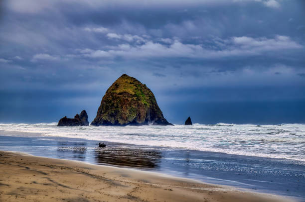 istock Haystack Rock at Cannon Beach  in Winter 1455593026