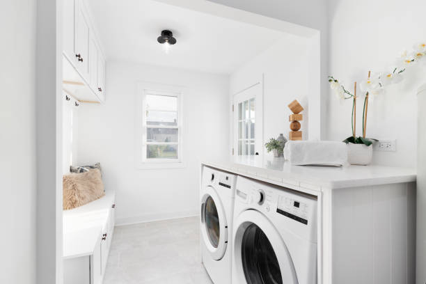 istock A bright, white laundry room and mud room. 1455595447