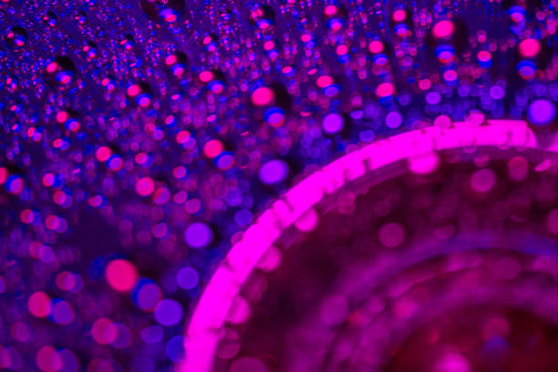 Pink, blue  and purple shinning abstract background of water droplets. Colorful modern background of glowing light bubbles like bokeh.