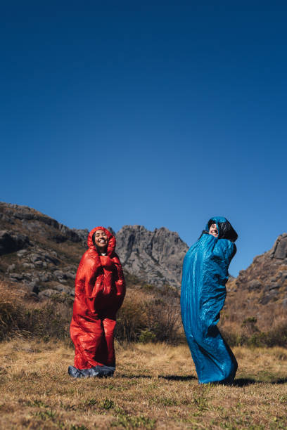 istock Women dressed in sleeping bag in the mountain 1455600899