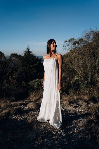 Woman in white dress in nature park