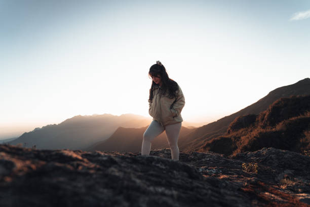 istock Woman walking in the mountains 1455601648