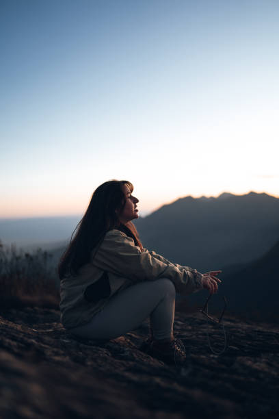 istock Woman enjoying the mountain scenery 1455601778