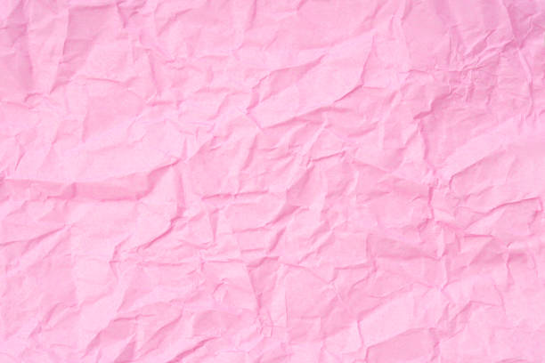 istock Crumpled pink paper texture background 1455603393