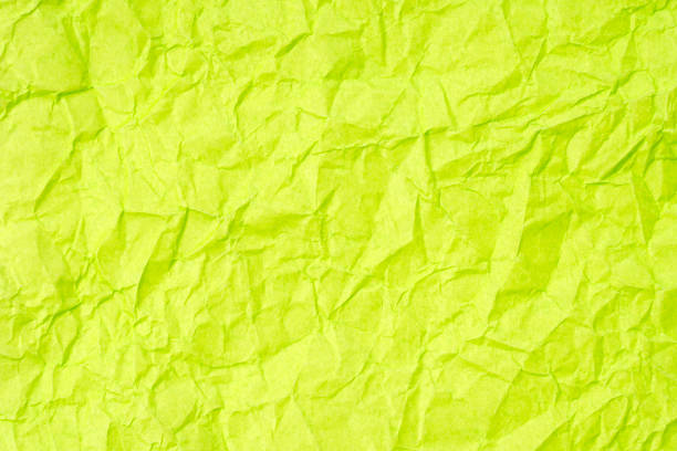 Crumpled yellow green paper texture background