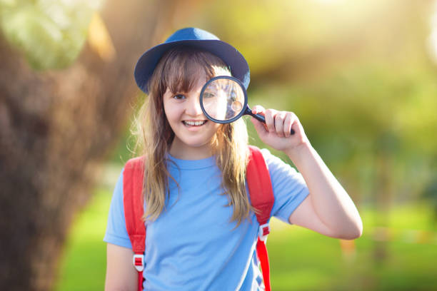 istock Kids explore nature. Children hike in sunny park. 1455606287