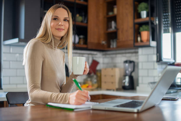 istock Young woman working from home 1455607390
