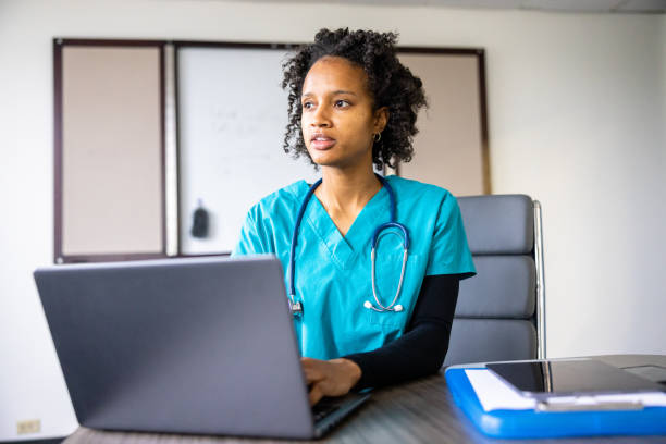 istock Medical student on laptop in classroom 1455610051