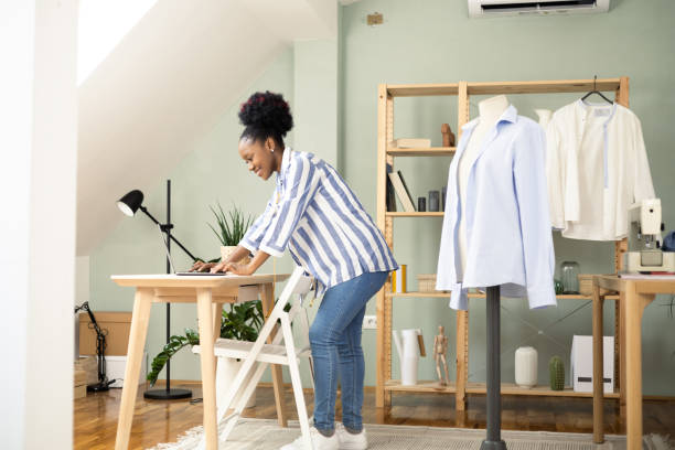 istock African American young woman making clothes at her sewing studio 1455610067