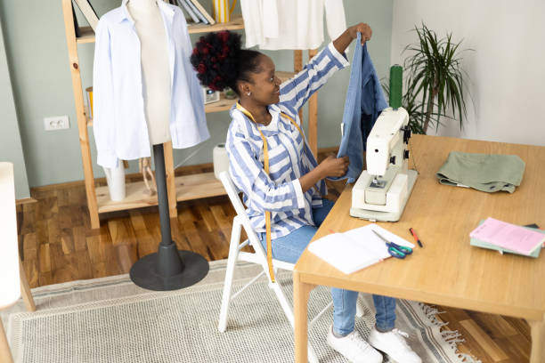 istock African American young woman making clothes at her sewing studio 1455610072