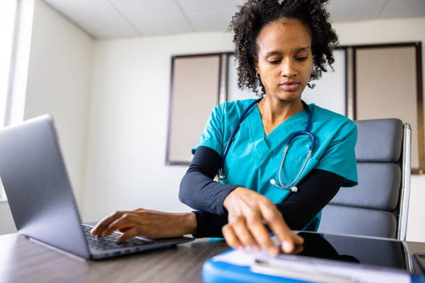 istock Medical student on laptop in classroom 1455610133